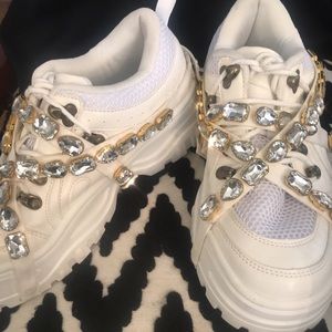 White oversized sneakers with jewel embellishments